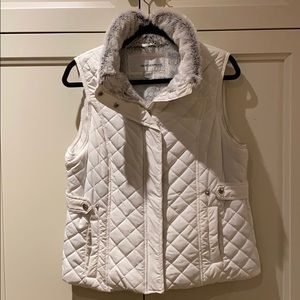 Weatherproof quilted vest with faux fur interior
